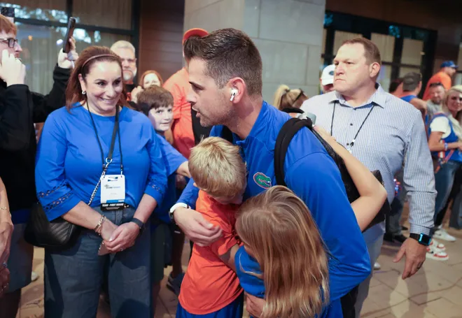 Florida head coach Todd Golden greets family before the NCAA March Madness opening round at JW Marriott in Tampa, FL on Friday, March 20, 2026. Several hundred people cheered Florida as they left to board the bus for to go to the arena. [Alan Youngblood/Gainesville Sun]
