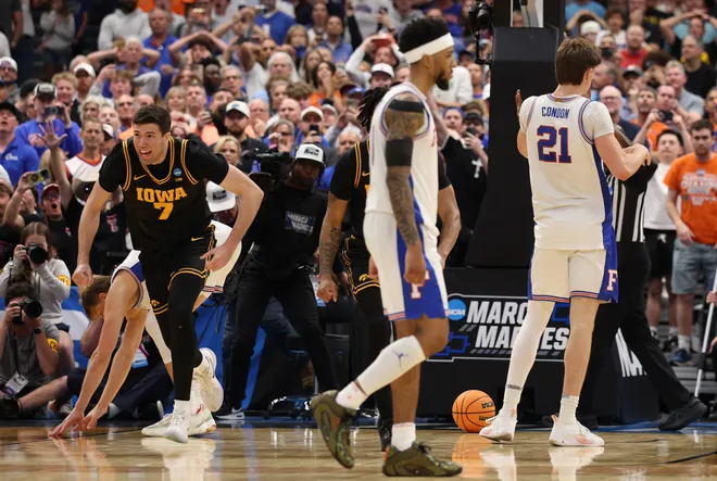 Mar 22, 2026; Tampa, FL, USA; Iowa Hawkeyes forward Alvaro Folgueiras (7) celebrates after defeating the Florida Gators in a second round game of the men's 2026 NCAA Tournament at Benchmark International Arena. Mandatory Credit: Nathan Ray Seebeck-Imagn Images