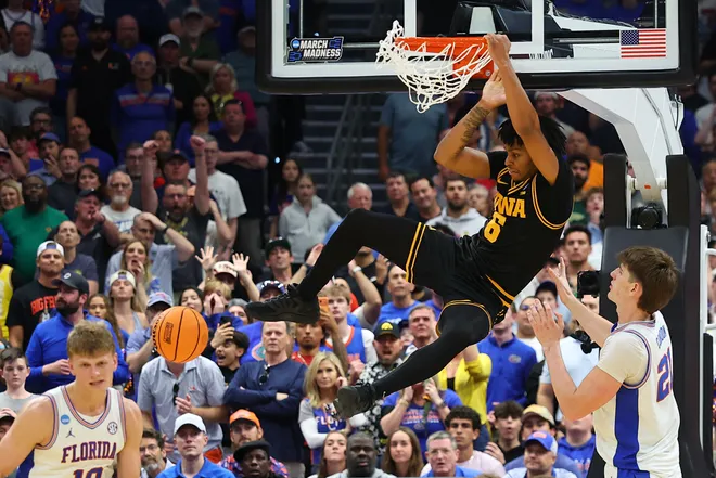 TAMPA, FLORIDA - MARCH 22: Tavion Banks #6 of the Iowa Hawkeyes dunks the ball against Alex Condon #21 of the Florida Gators during the second half in the second round of the 2026 NCAA Men's Basketball Tournament at Benchmark International Arena on March 22, 2026 in Tampa, Florida. (Photo by Mike Carlson/Getty Images)