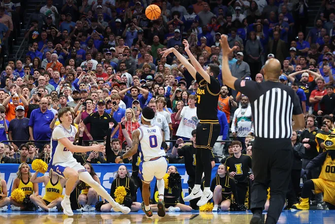 TAMPA, FLORIDA - MARCH 22: Alvaro Folgueiras #7 of the Iowa Hawkeyes attempts a three point basket against the Florida Gators with under five seconds left during the second half in the second round of the 2026 NCAA Men's Basketball Tournament at Benchmark International Arena on March 22, 2026 in Tampa, Florida. (Photo by Mike Carlson/Getty Images)