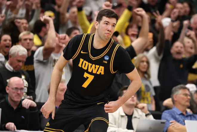 Mar 22, 2026; Tampa, FL, USA; Iowa Hawkeyes forward Alvaro Folgueiras (7) makes a go-ahead three-point basket against the Florida Gators late in the second half during a second round game of the men's 2026 NCAA Tournament at Benchmark International Arena. Mandatory Credit: Nathan Ray Seebeck-Imagn Images