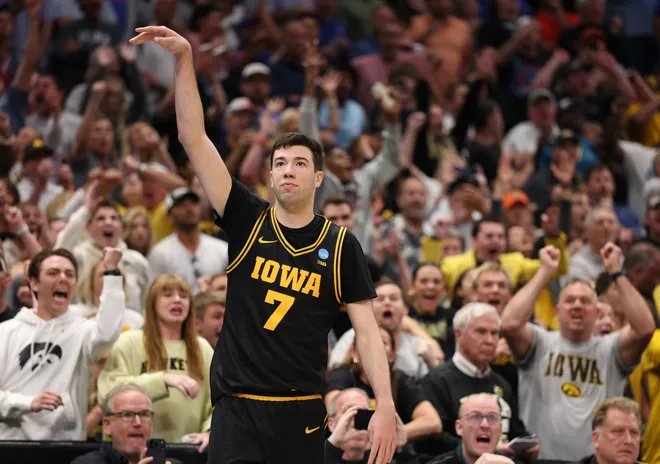 Mar 22, 2026; Tampa, FL, USA; Iowa Hawkeyes forward Alvaro Folgueiras (7) makes a go-ahead three-point basket against the Florida Gators late in the second half during a second round game of the men's 2026 NCAA Tournament at Benchmark International Arena. Mandatory Credit: Nathan Ray Seebeck-Imagn Images