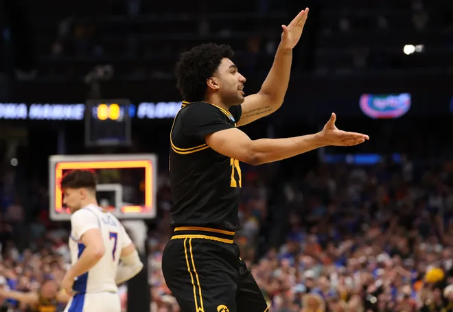 Mar 22, 2026; Tampa, FL, USA; Iowa Hawkeyes guard Kael Combs (11) celebrates after defeating the Florida Gators in a second round game of the men's 2026 NCAA Tournament at Benchmark International Arena. Mandatory Credit: Matt Pendleton-Imagn Images