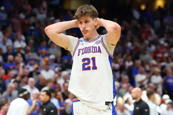 TAMPA, FLORIDA - MARCH 22: Alex Condon #21 of the Florida Gators reacts after being defeated by the Iowa Hawkeyes in the second round of the 2026 NCAA Men's Basketball Tournament at Benchmark International Arena on March 22, 2026 in Tampa, Florida. (Photo by Mike Carlson/Getty Images)