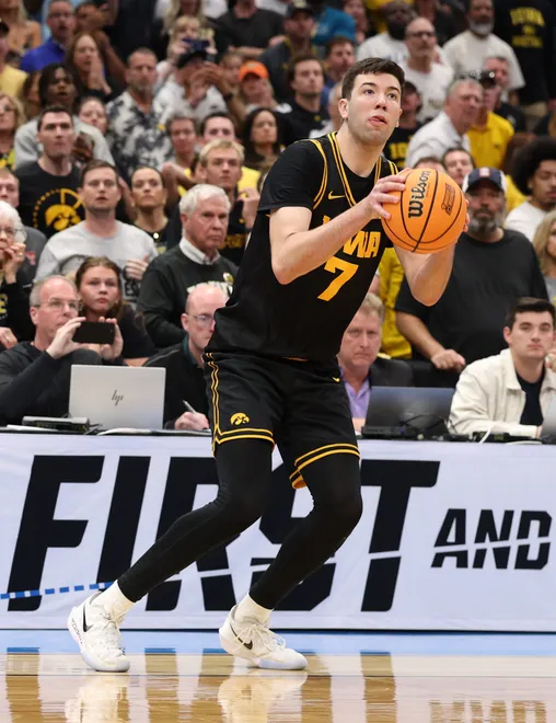Mar 22, 2026; Tampa, FL, USA; Iowa Hawkeyes forward Alvaro Folgueiras (7) makes a go-ahead three-point basket against the Florida Gators late in the second half during a second round game of the men's 2026 NCAA Tournament at Benchmark International Arena. Mandatory Credit: Nathan Ray Seebeck-Imagn Images