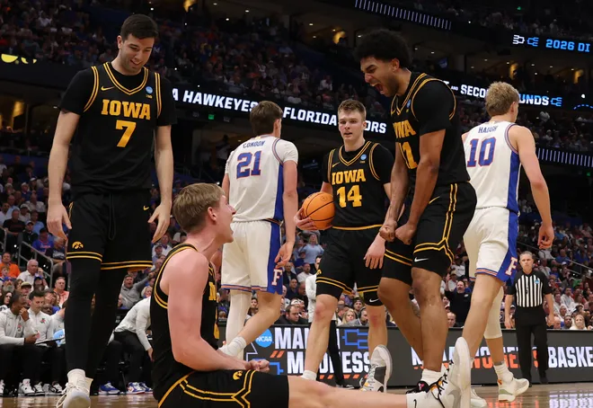 Mar 22, 2026; Tampa, FL, USA; Iowa Hawkeyes forward Cooper Koch (8) and Iowa Hawkeyes guard Kael Combs (11) celebrate after a play against the Florida Gators in the second half during a second round game of the men's 2026 NCAA Tournament at Benchmark International Arena. Mandatory Credit: Matt Pendleton-Imagn Images