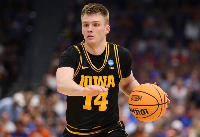 Mar 22, 2026; Tampa, FL, USA; Iowa Hawkeyes guard Bennett Stirtz (14) dribbles the ball against the Florida Gators in the second half during a second round game of the men's 2026 NCAA Tournament at Benchmark International Arena. Mandatory Credit: Nathan Ray Seebeck-Imagn Images