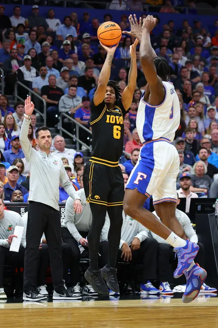 TAMPA, FLORIDA - MARCH 22: Tavion Banks #6 of the Iowa Hawkeyes shoots the ball against Rueben Chinyelu #9 of the Florida Gators during the first half in the second round of the 2026 NCAA Men's Basketball Tournament at Benchmark International Arena on March 22, 2026 in Tampa, Florida. (Photo by Mike Carlson/Getty Images)