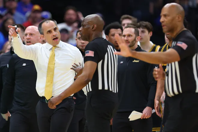 TAMPA, FLORIDA - MARCH 22: Head coach Ben McCollum of the Iowa Hawkeyes speaks with an official during the first half against the Florida Gators in the second round of the 2026 NCAA Men's Basketball Tournament at Benchmark International Arena on March 22, 2026 in Tampa, Florida. (Photo by Mike Carlson/Getty Images)
