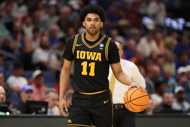 Mar 22, 2026; Tampa, FL, USA; Iowa Hawkeyes guard Kael Combs (11) dribbles the ball against the Florida Gators in the first half during a second round game of the men's 2026 NCAA Tournament at Benchmark International Arena. Mandatory Credit: Matt Pendleton-Imagn Images