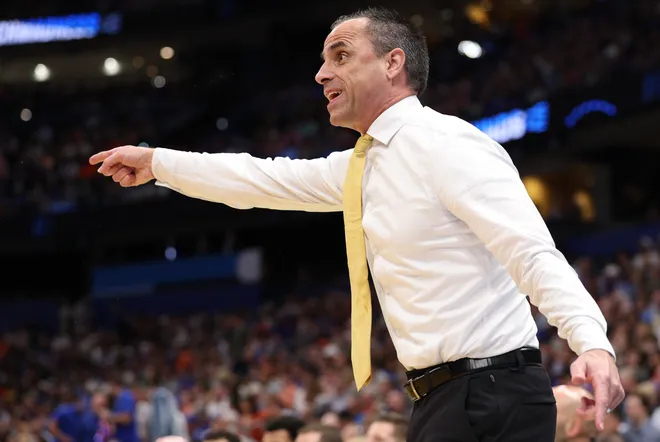 Mar 22, 2026; Tampa, FL, USA; Iowa Hawkeyes head coach Ben McCollum instructs his team against the Florida Gators in the first half during a second round game of the men's 2026 NCAA Tournament at Benchmark International Arena. Mandatory Credit: Nathan Ray Seebeck-Imagn Images