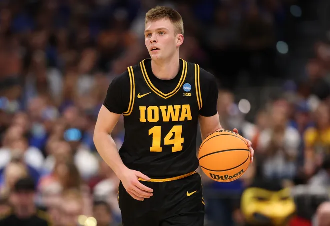 Mar 22, 2026; Tampa, FL, USA; Iowa Hawkeyes guard Bennett Stirtz (14) dribbles the ball against the Florida Gators in the first half during a second round game of the men's 2026 NCAA Tournament at Benchmark International Arena. Mandatory Credit: Matt Pendleton-Imagn Images