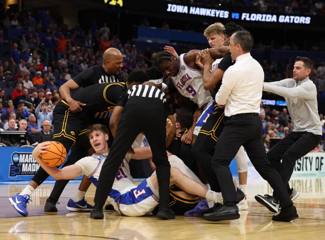 Mar 22, 2026; Tampa, FL, USA; A fight breaks out between the Florida Gators and the Iowa Hawkeyes in the first half during a second round game of the men's 2026 NCAA Tournament at Benchmark International Arena. Mandatory Credit: Nathan Ray Seebeck-Imagn Images