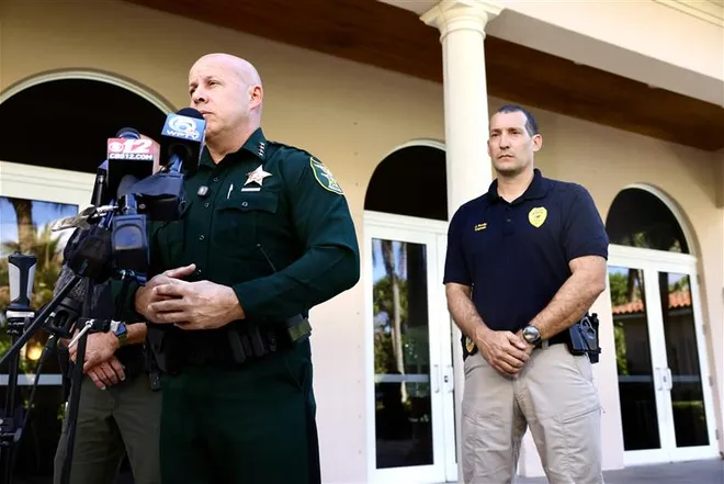 Martin County Sheriff John Budensiek discusses arrest of Tiger Woods after traffic crash on Beach Road on Jupiter Island. He stands in front of Jupiter Island Town Hall.