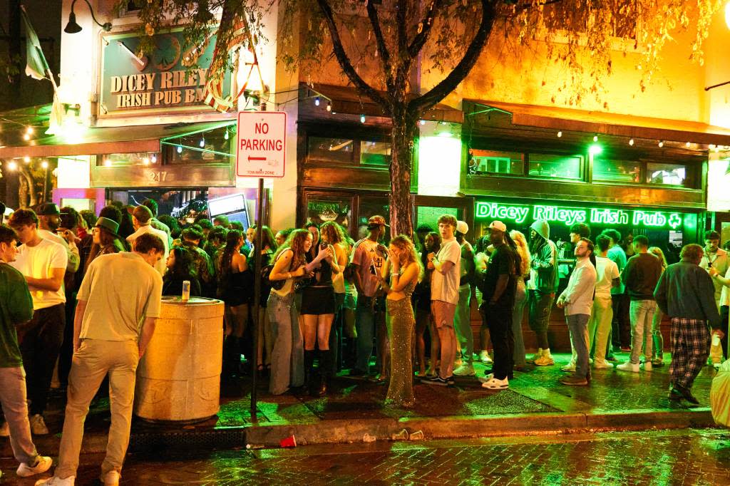 People gathered outside of Dicey Riley’s Irish Pub on the night of the brawl. Romain Maurice