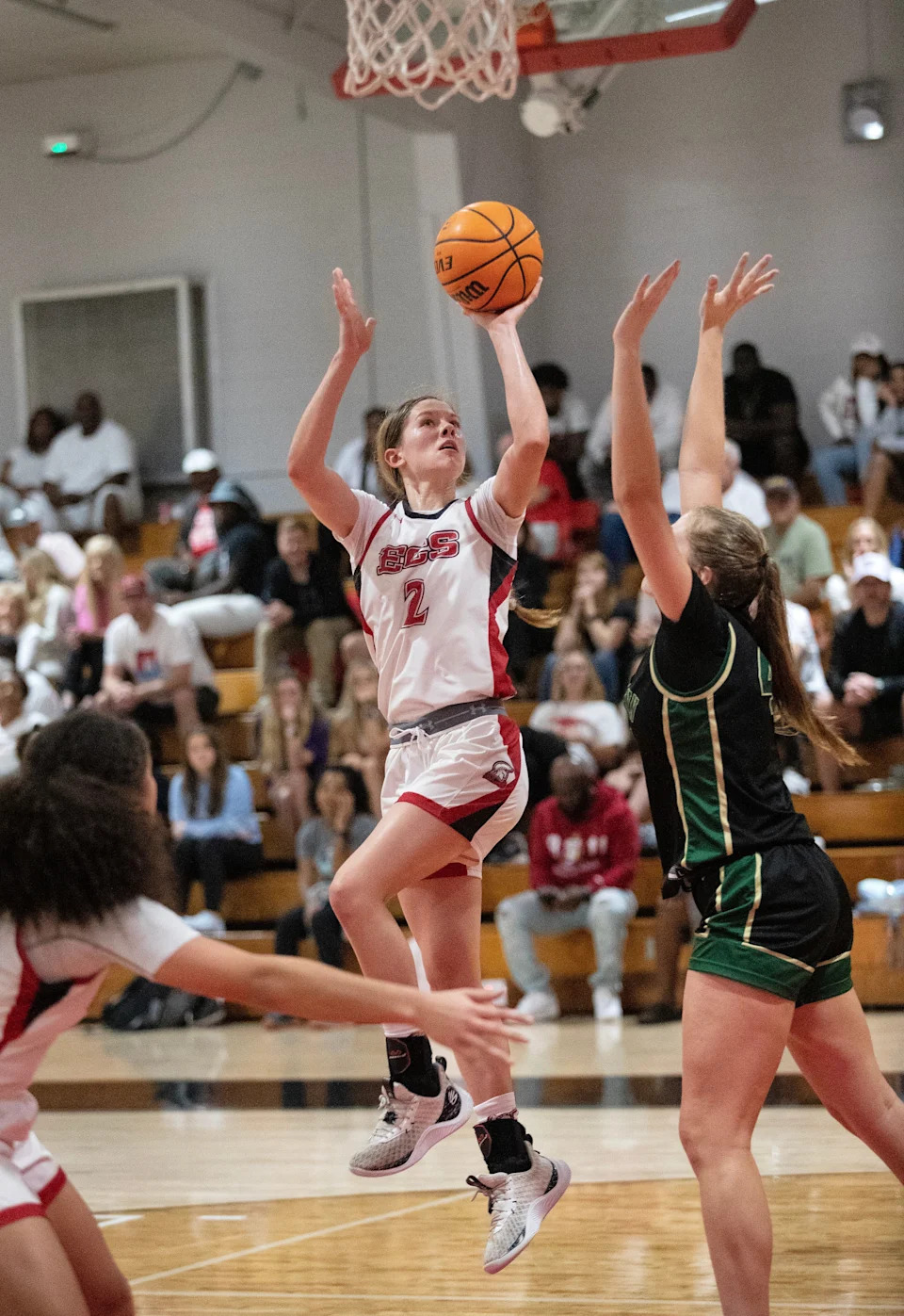 Maddie O'Berski of ECS takes a shot over Sophia McCartney of St. John Neumann in the Private 8 Girls Basketball Championship game on Friday, Jan. 19, 2024, at Evangelical Christian School in Fort Myers.