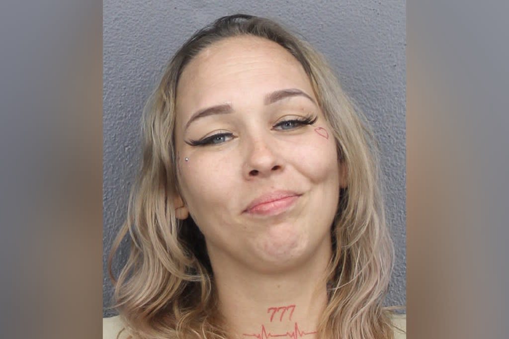 Magdalena Dybkowska grinned as she was booked on attempted murder charges. Broward County Jail