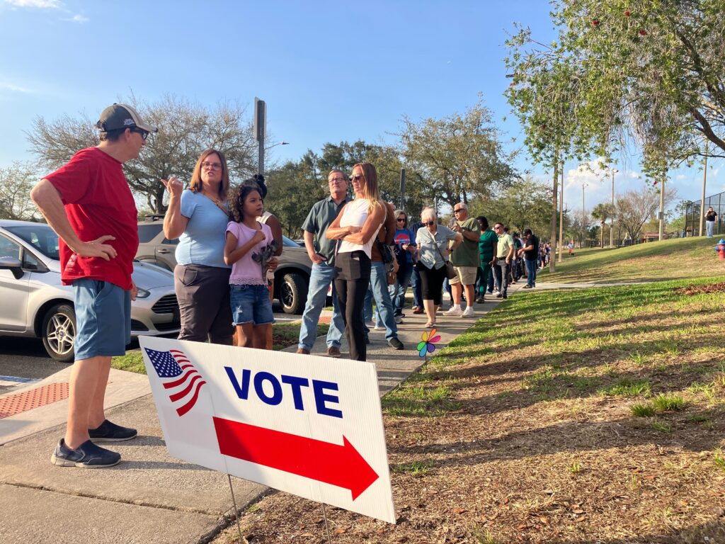 Voters wait in line at the Northwest Recreation Complex on the evening of March 10.