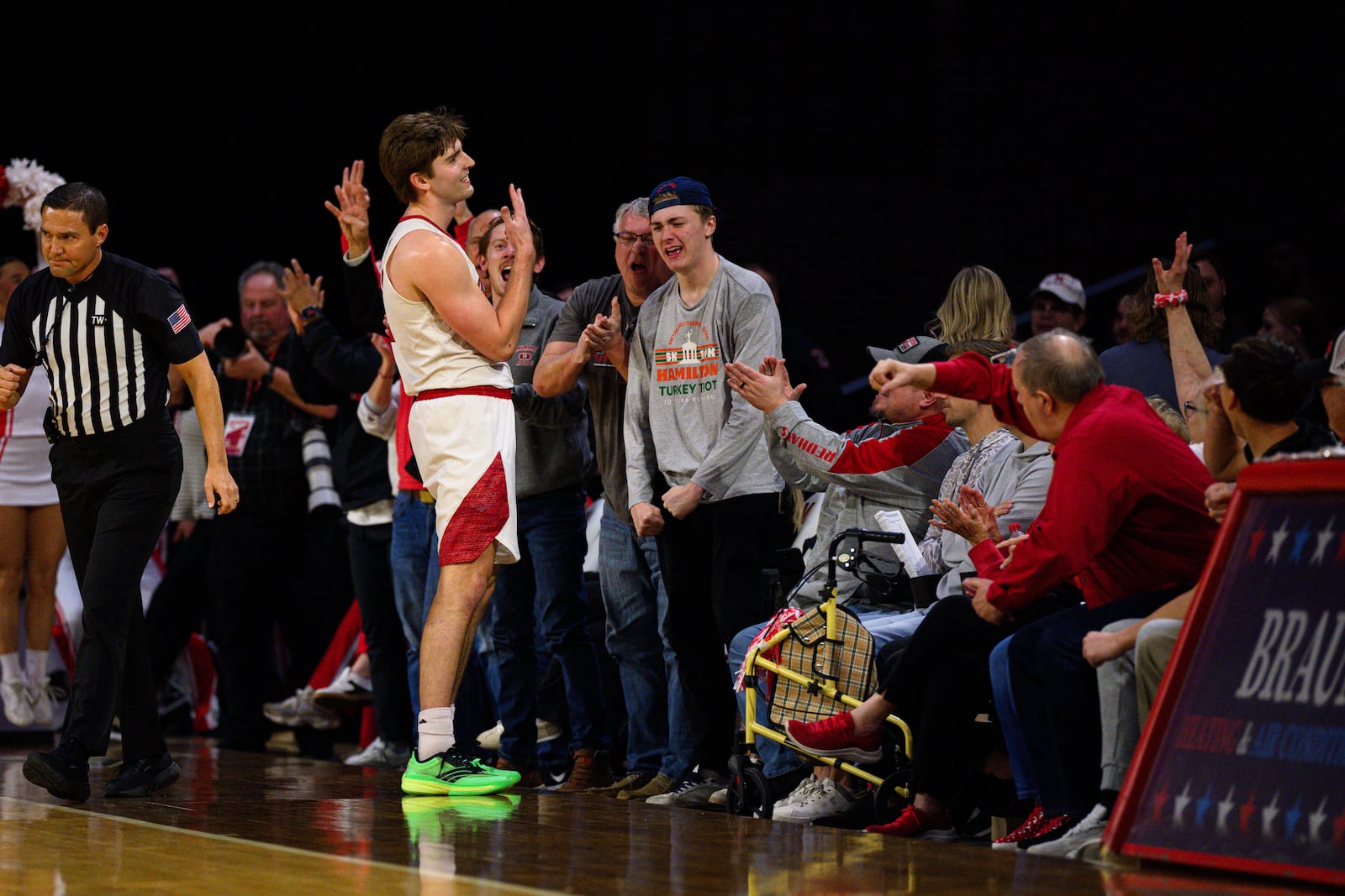 Miami University's Peter Suder celebrates with fans during the first half of their Mid-American Conference men's basketball game against Toledo on Tuesday, March 3, 2026 at Millett Hall. JEREMY MILLER / CONTRIBUTED PHOTO