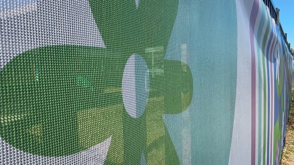 "It makes me happy," one student said when she saw the fence for the first time.