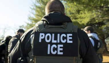 An ICE officer carrying out deportations