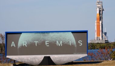 FILE — NASA's Artemis II SLS (Space Launch System) moon rocket with the Orion spacecraft slowly rolls back towards the Vehicle Assembly Building at the Kennedy Space Center, Wednesday, Feb. 25, 2026, in Cape Canaveral, Fla. (AP Photo/John Raoux)