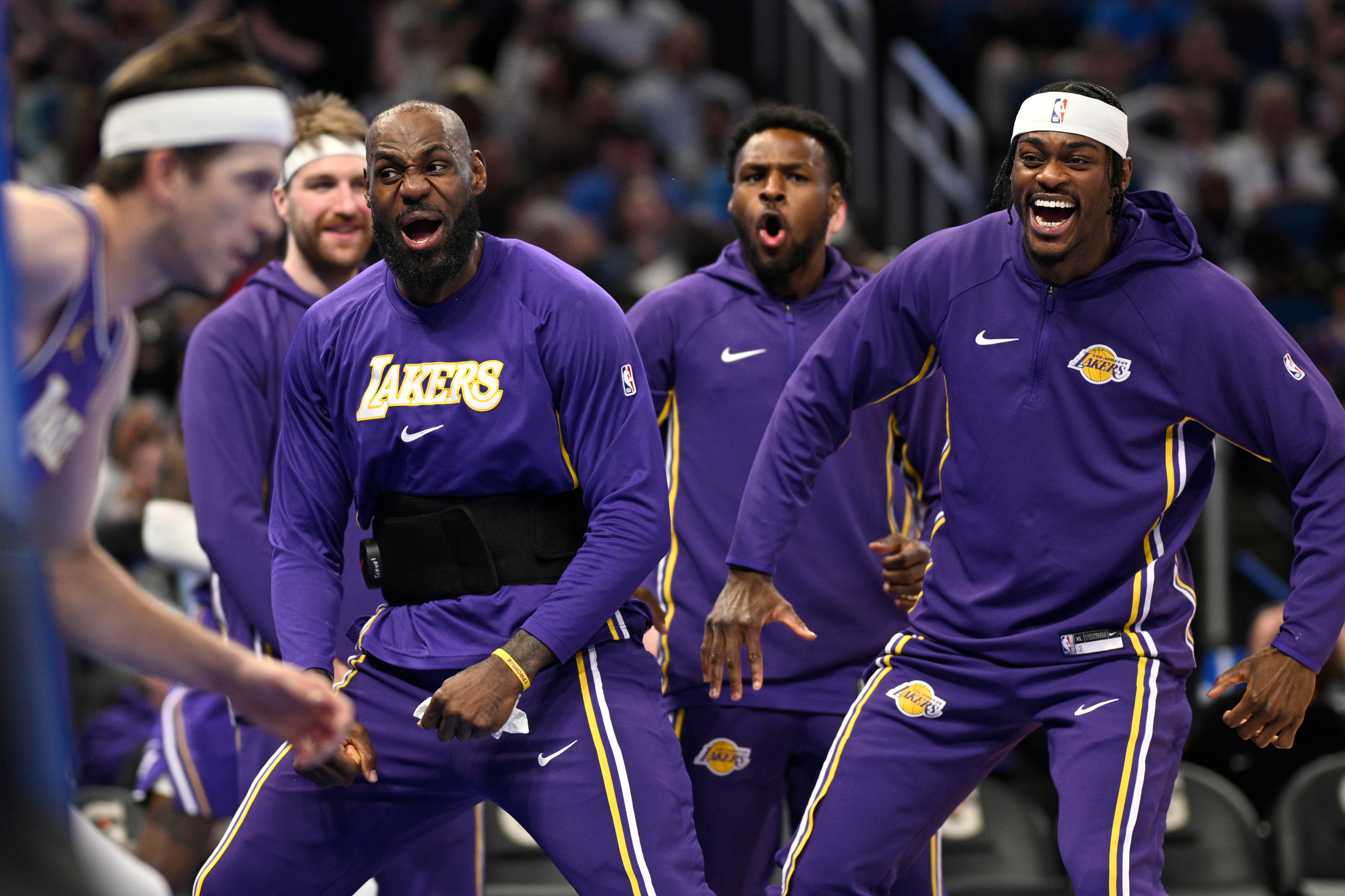 Lakers forward LeBron James, second from front right, and forward...