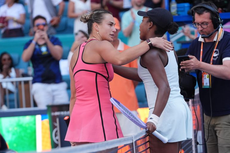 Aryna Sabalenka and Coco Gauff react. 