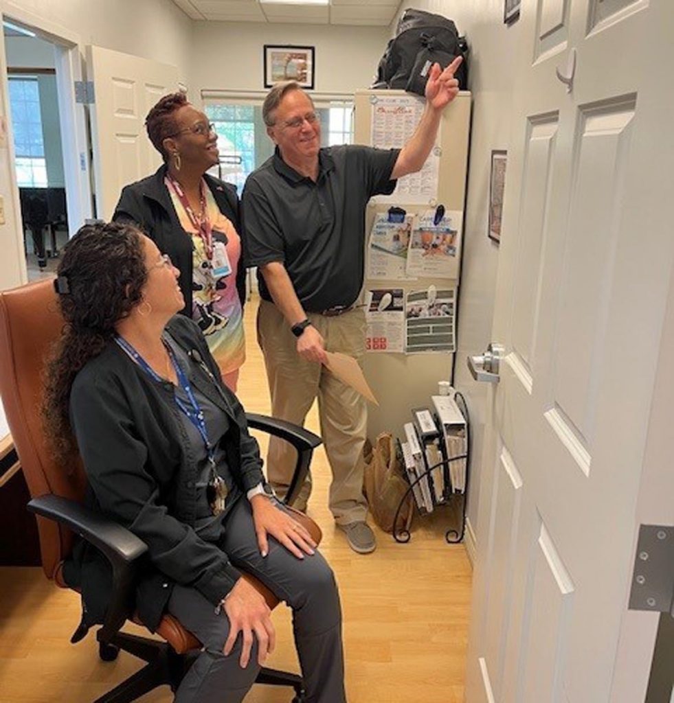 Adam Levenson from the Council on Aging Martin County shows Adult Day Club nurses Mayra Fuentes and Lashaka Bacon how the current space at the Kane Center will be reconfigured to create a more welcoming and expansive setting for both the Adult Day Club and the Memory Enhancement Center.
