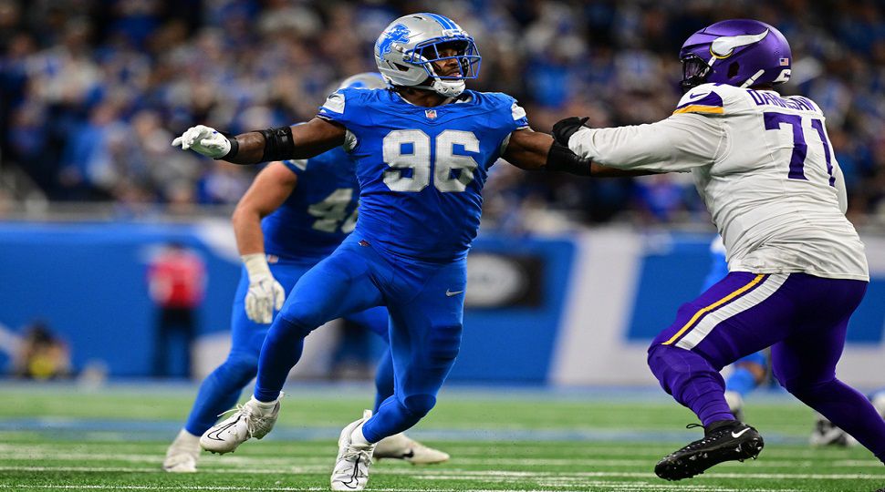 Detroit Lions linebacker Al-Quadin Muhammad rushes the quarterback during the second half of an NFL football game against the Minnesota Vikings in Detroit, Sunday, Nov. 2, 2025. (AP Photo/David Dermer)