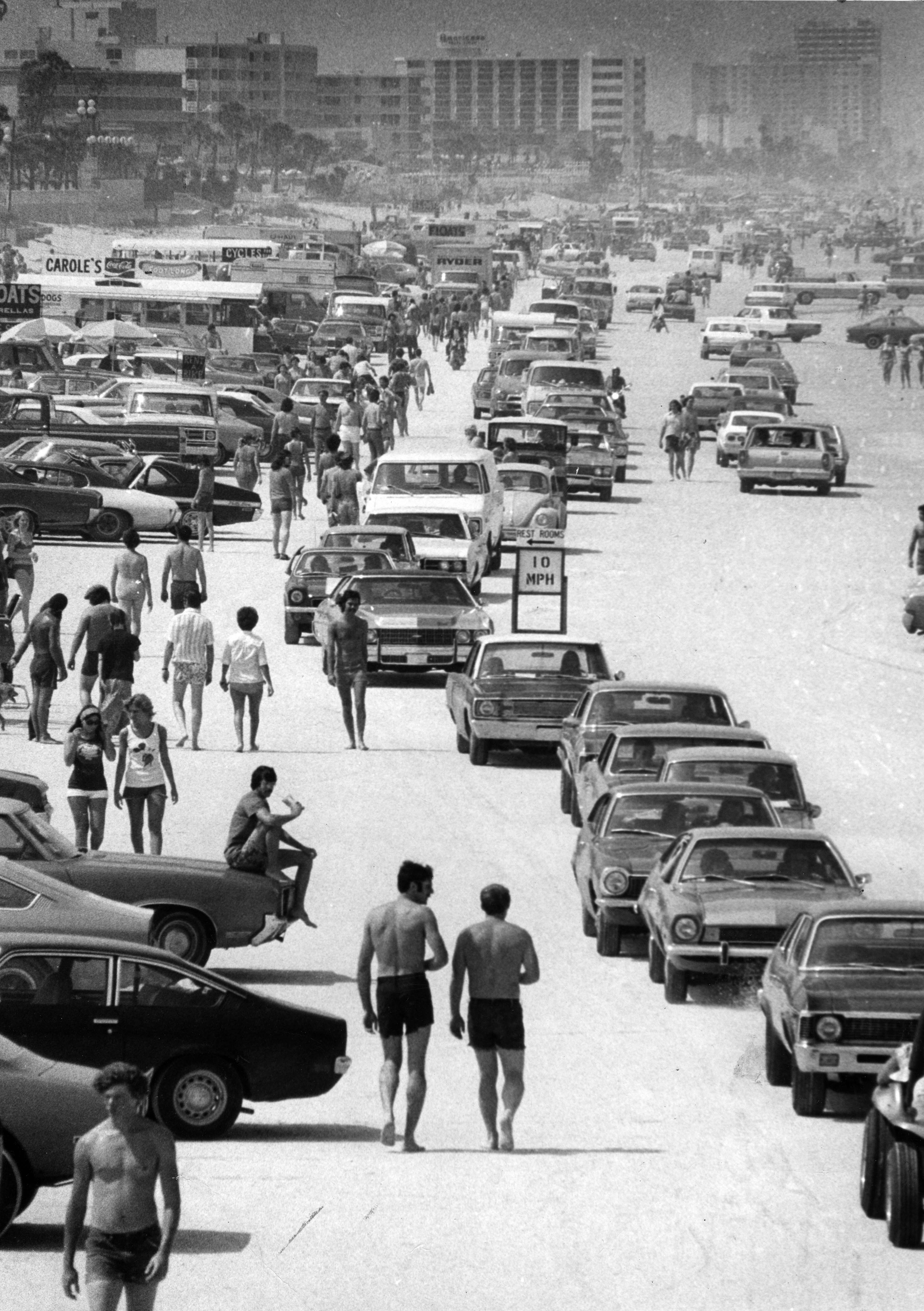Cars drive up and down the beaches of Volusia county...