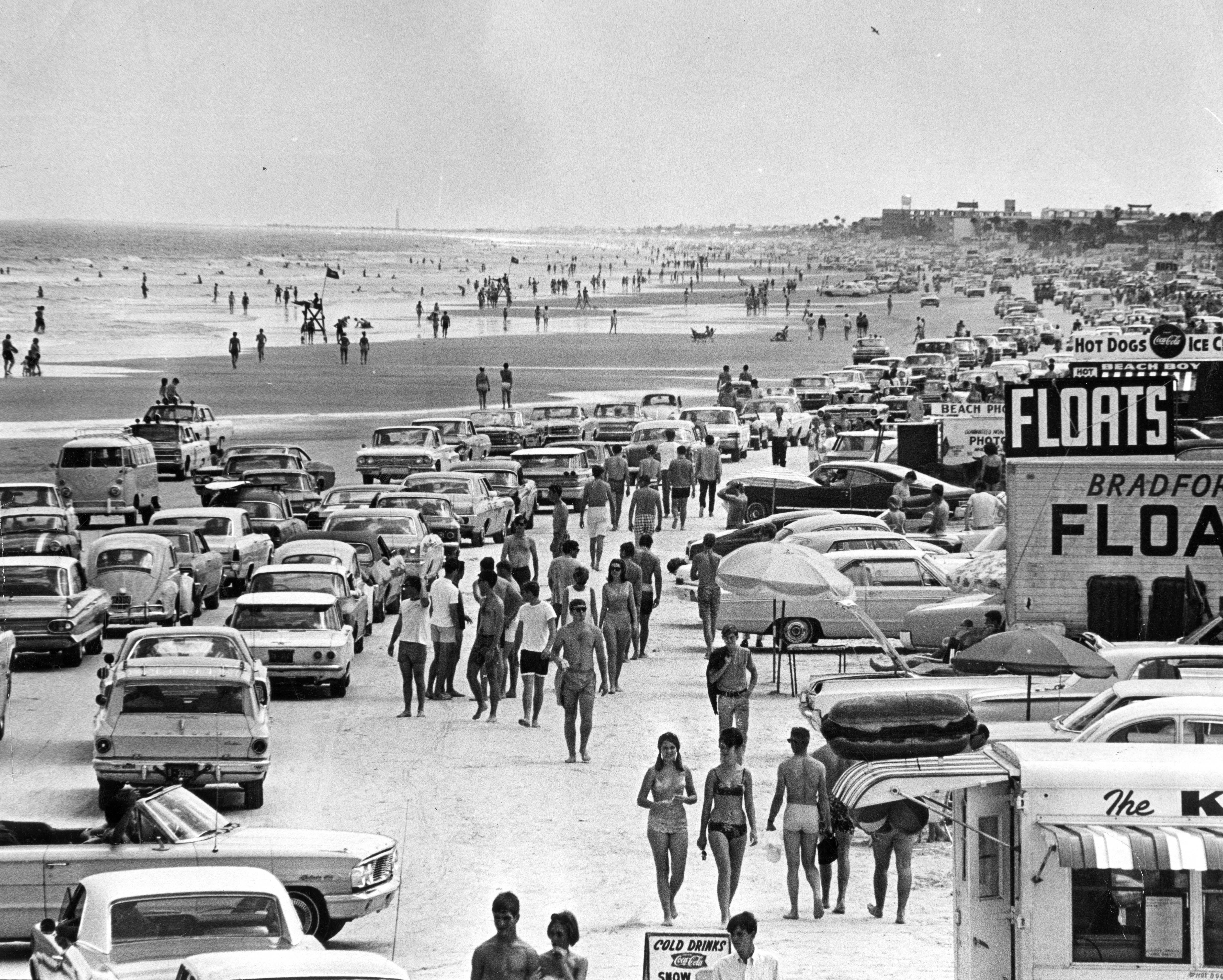 Visitors, traffic, and food vendors along the beach during Spring...