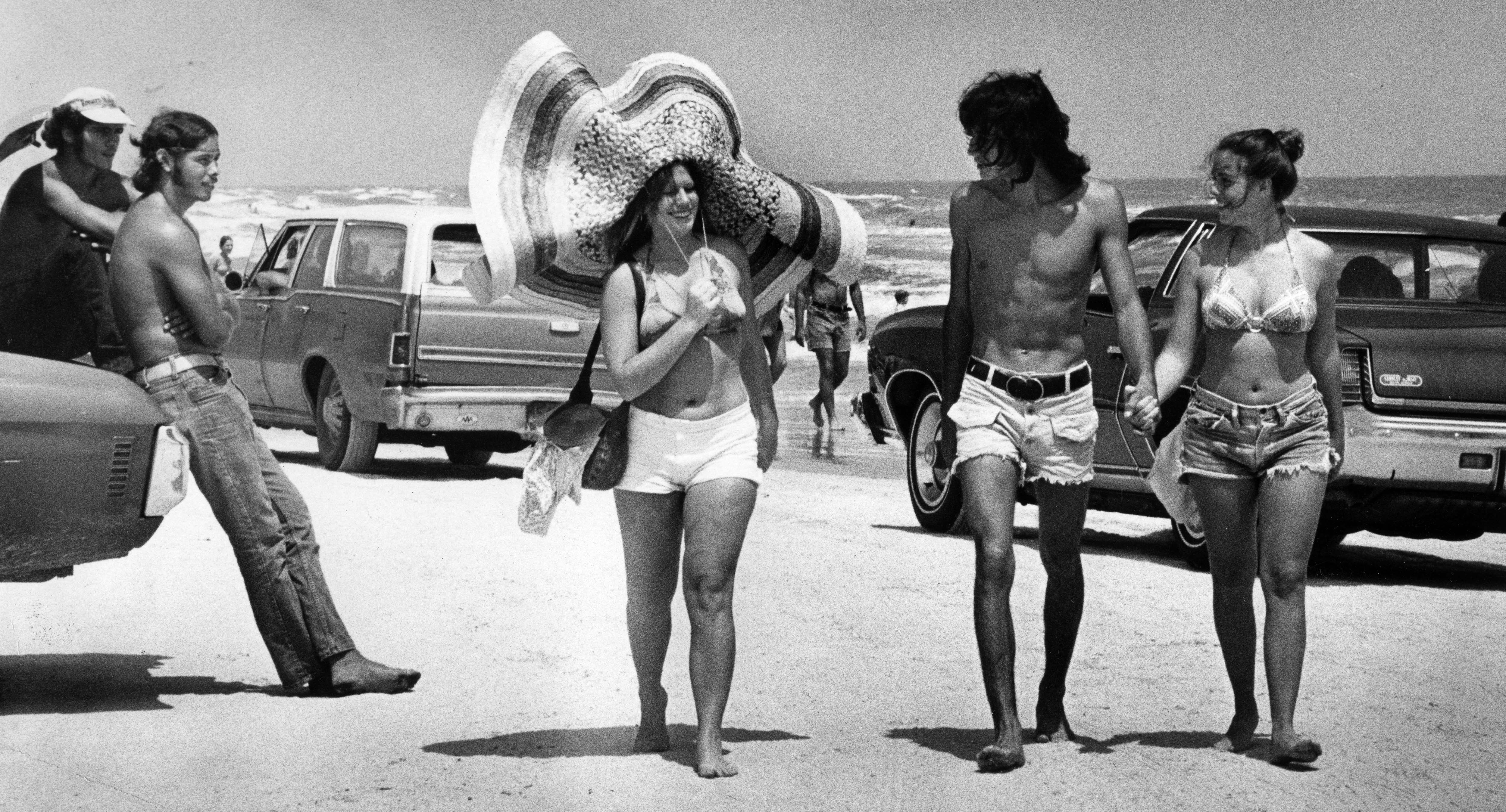 Debbie Malin of Ft. Lauderdale wears a big hat during...