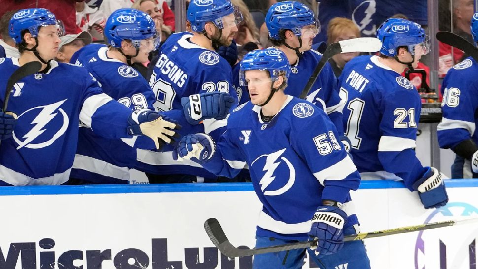 Tampa Bay Lightning center Jake Guentzel (59) celebrates his goal against the Detroit Red Wings with the bench during the third period of an NHL hockey game Thursday, March 12, 2026, at Benchmark International Arena in Tampa, Fla. (AP Photo/Chris O'Meara)