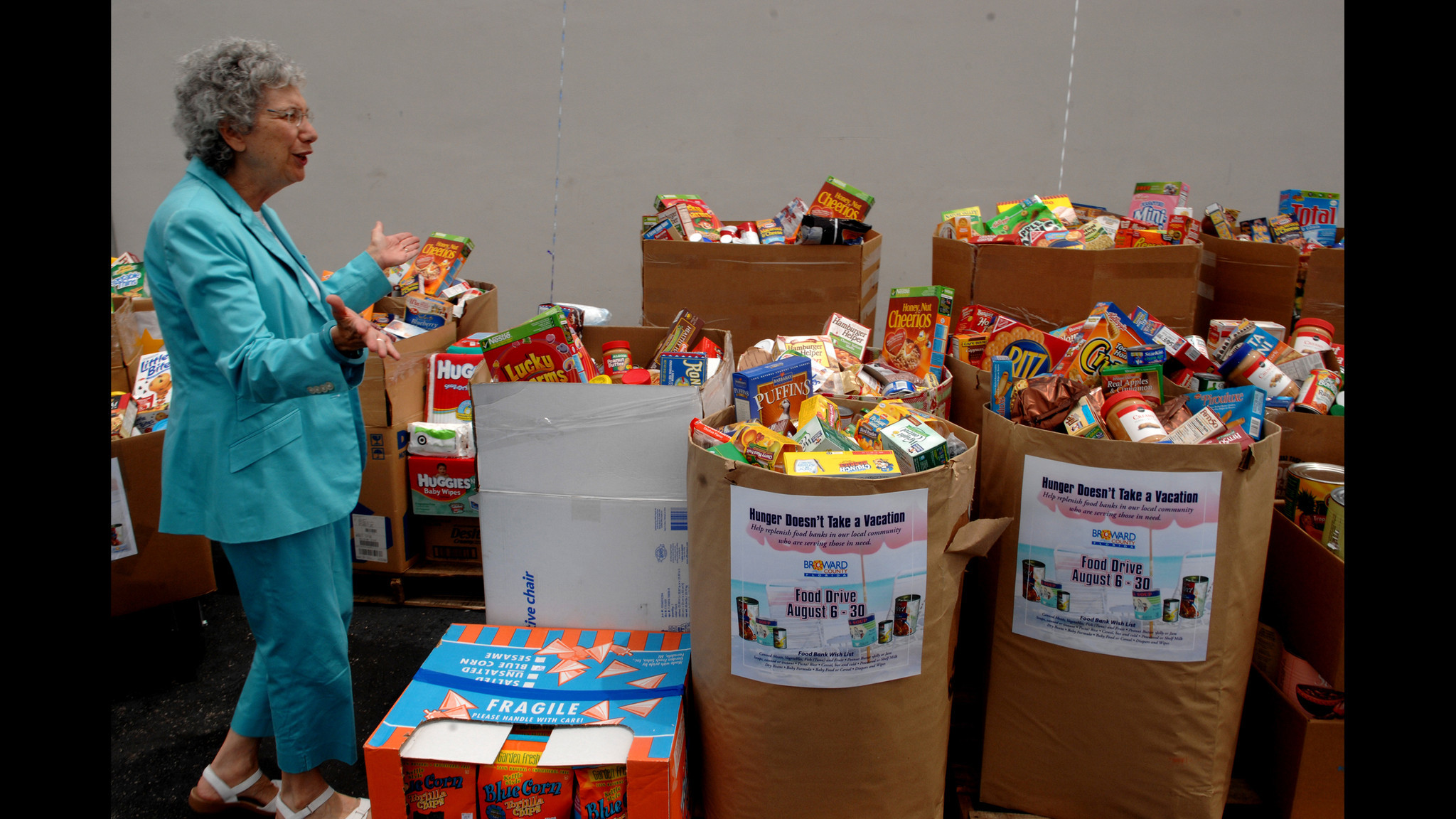 Broward County Commissioner Sue Gunzburger check over 6.000 pounds of...