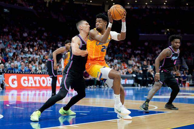 Charlotte’s Brandon Miller backs down the Miami Heat’s Tyler Herro during early first-half action on Friday, March 6, 2026.