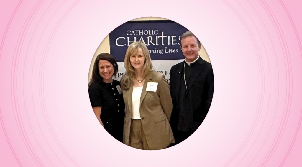 Catholic Charities Jacksonville Board member Kate Campbell with Regional Director Eileen Seuter and Bishop Erik Pohlmeier at the organization’s annual meeting.