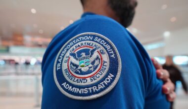 A TSA agent wears a U.S. Department of Homeland Security patch on their uniform at Love Field Airport, in Dallas, Wednesday, Feb. 18, 2026. (AP Photo/LM Otero)