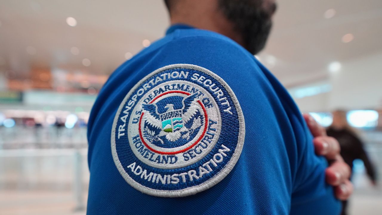 A TSA agent wears a U.S. Department of Homeland Security patch on their uniform at Love Field Airport, in Dallas, Wednesday, Feb. 18, 2026. (AP Photo/LM Otero)