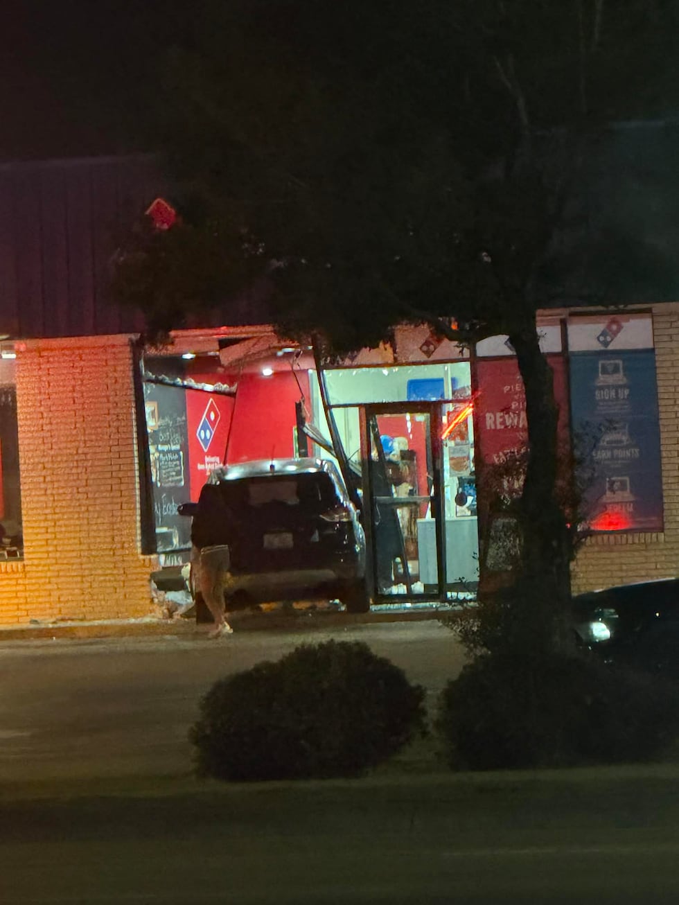 A vehicle crashed into Domino's around 10:45 p.m. Friday night.