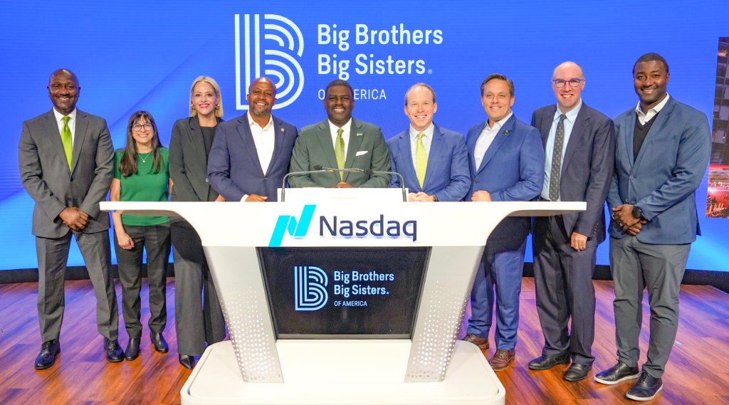 Jason Spencer stands on the far right on the Nasdaq floor as BBBSNELF celebrates 120 years by ringing the stock exchange’s opening bell last November.