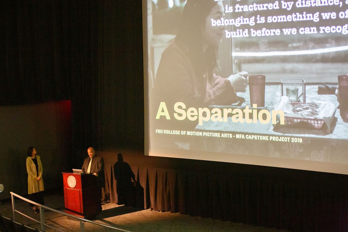 David Barrow Wiley and Laura Lee in front of a movie screen