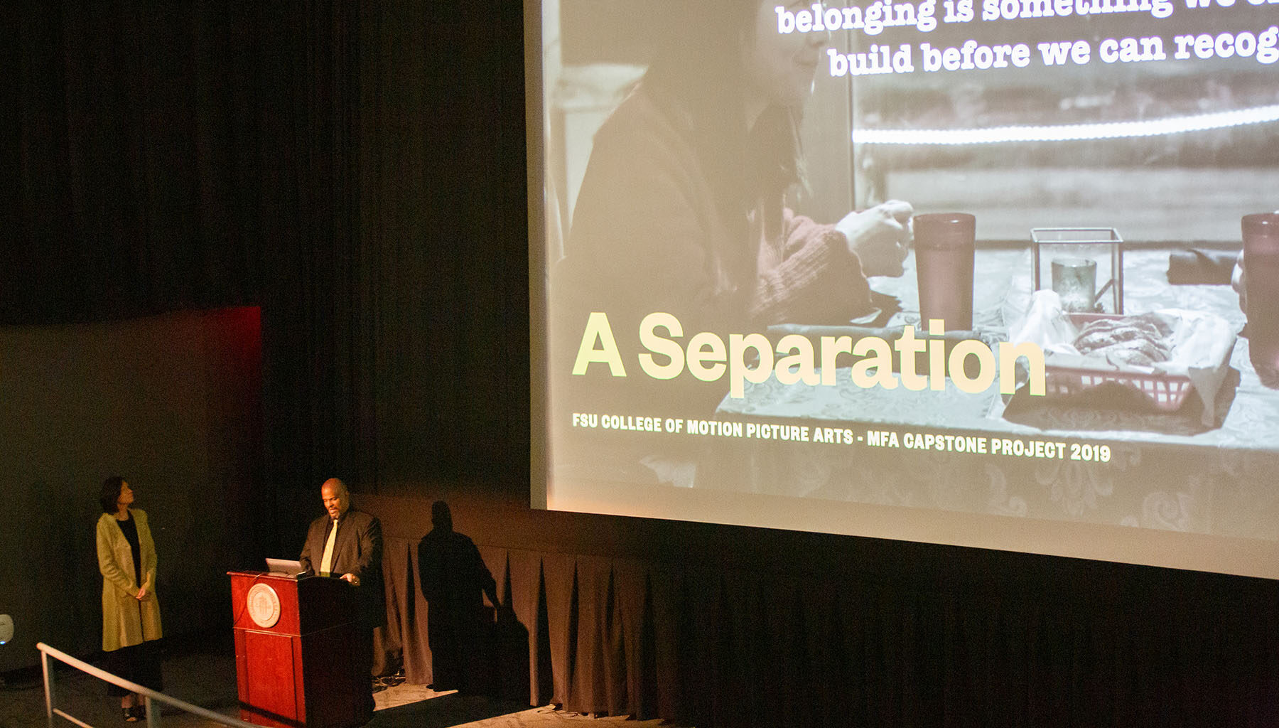 David Barrow Wiley and Laura Lee in front of a movie screen