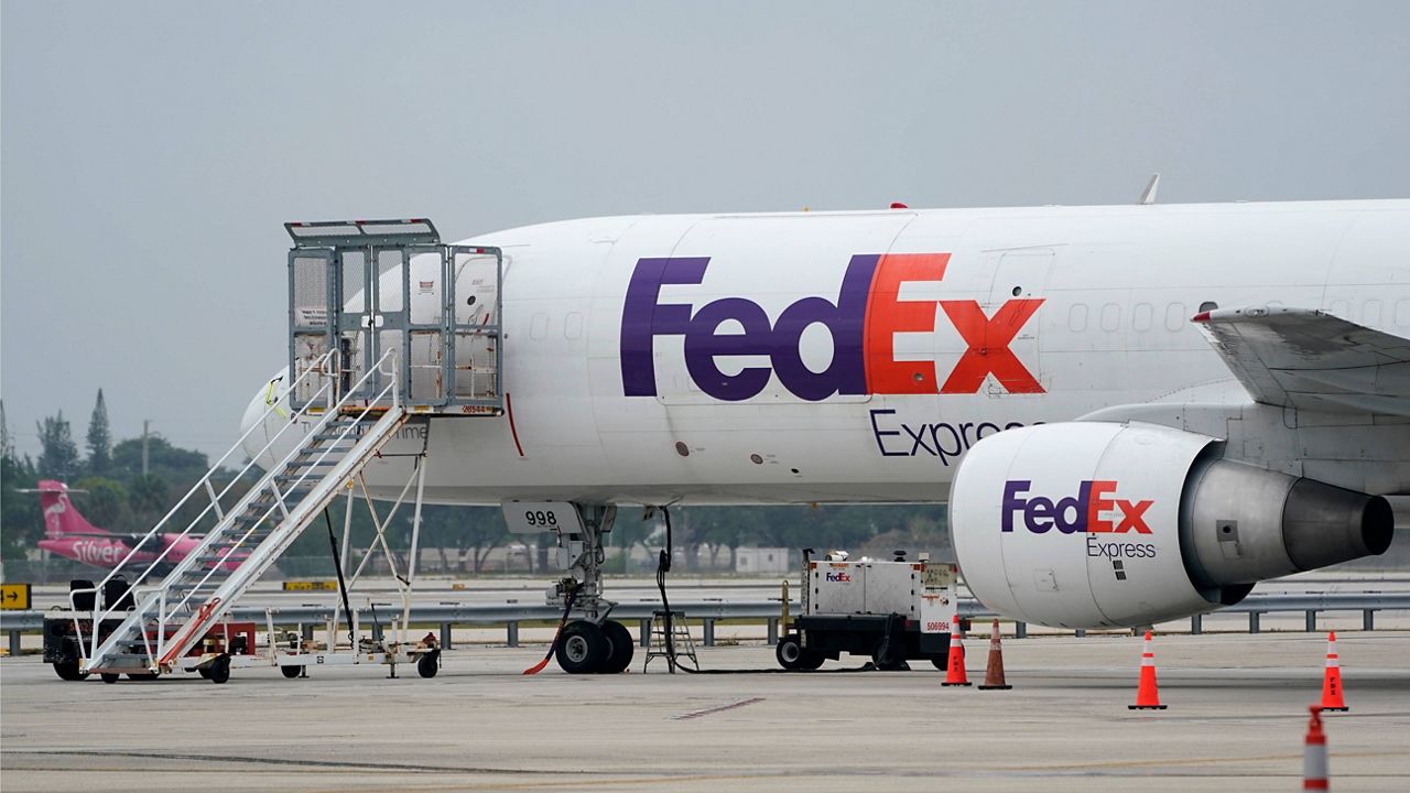 A FedEx cargo plane is shown on the tarmac at Fort Lauderdale-Hollywood International Airport, Tuesday, April 20, 2021, in Fort Lauderdale, Fla. (AP Photo/Wilfredo Lee, File)
