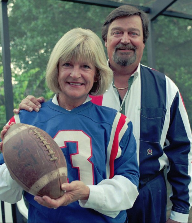 Pat Palinkas wears her old Orlando Panthers football jersey and poses with husband Steve in this 1997 photo at their home. (Orlando Sentinel file)