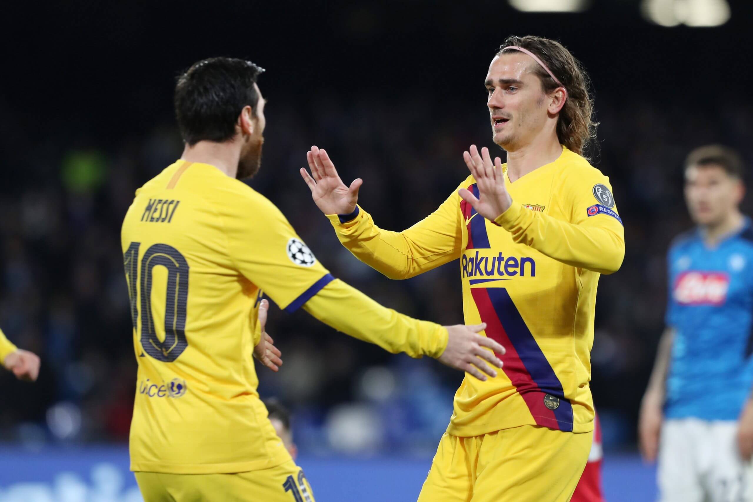 Messi and Griezmann celebrate during a Barcelona Champions League match in February 2020