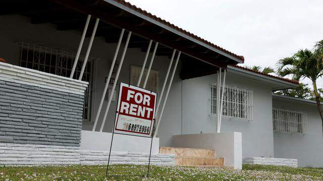 A "For rent" sign is posted in front of a home on Dec. 12, 2023 in Miami.