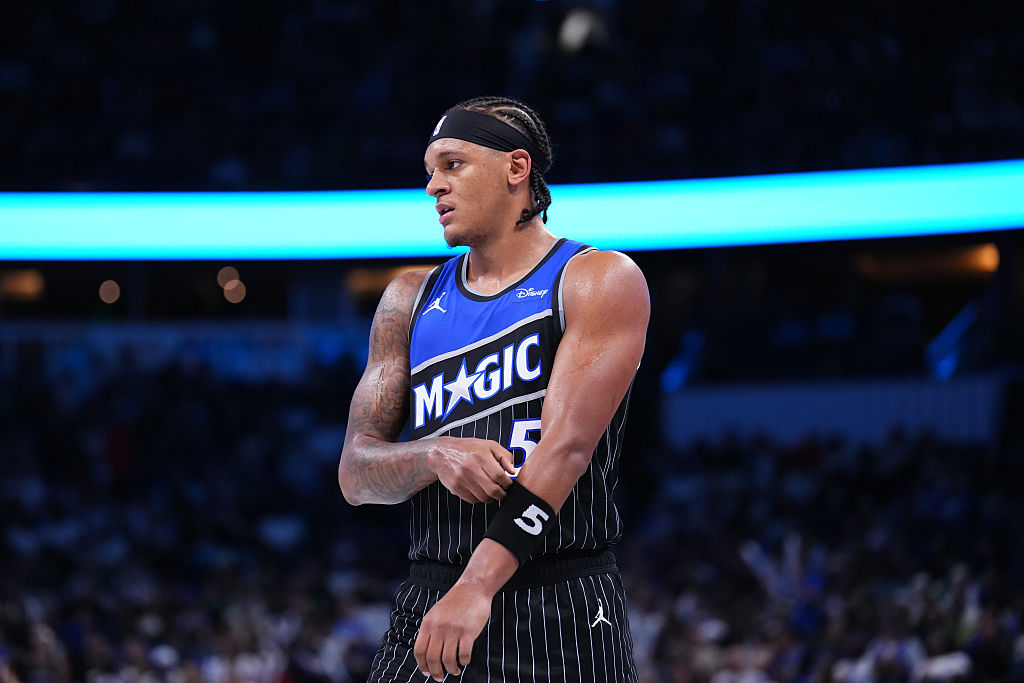 ORLANDO, FLORIDA - NOVEMBER 07: Paolo Banchero #5 of the Orlando Magic looks on during the third quarter of an NBA Cup game against the Boston Celtics at Kia Center on November 07, 2025 in Orlando, Florida. NOTE TO USER: User expressly acknowledges and agrees that, by downloading and/or using this photograph, user is consenting to the terms and conditions of the Getty Images License Agreement. (Photo by Rich Storry/Getty Images)