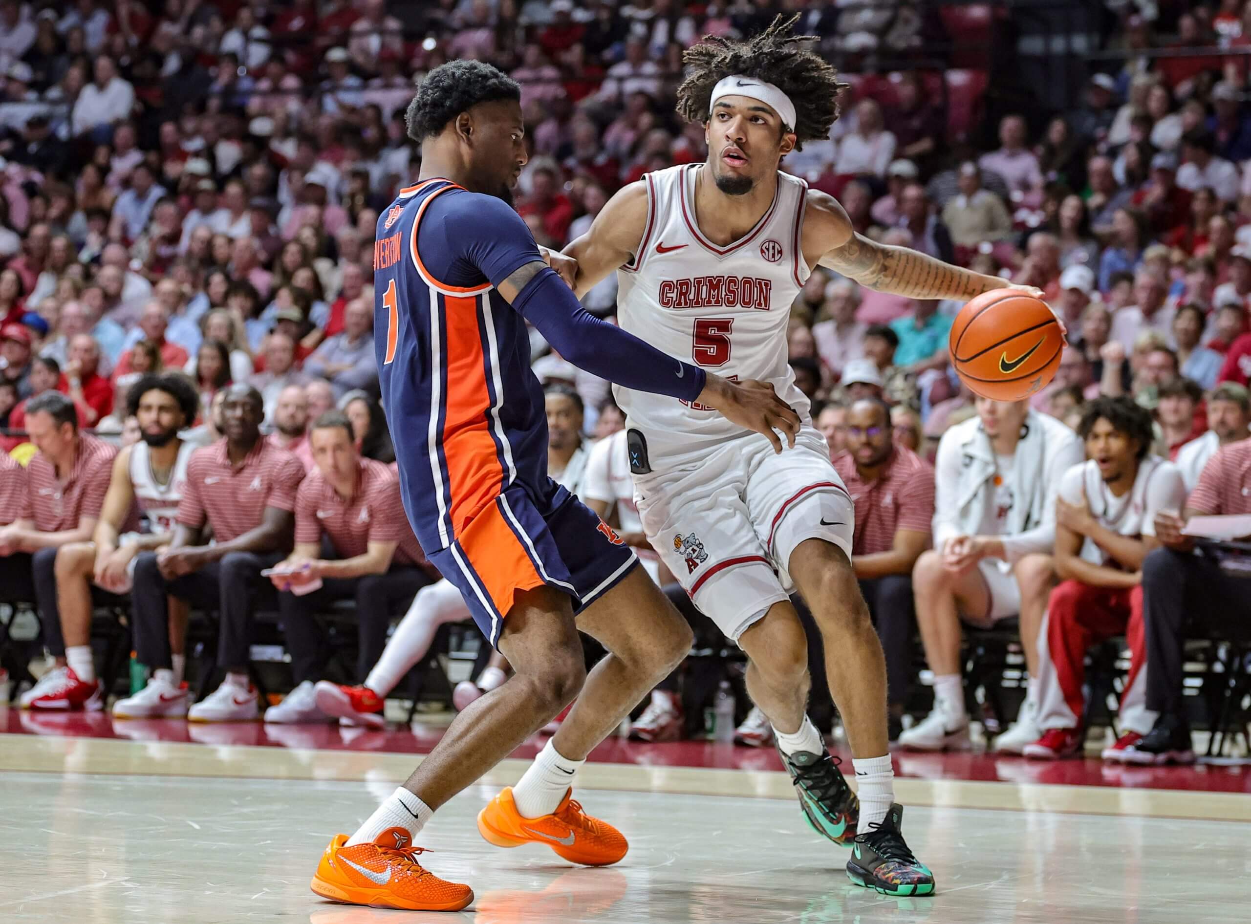 Amari Allen drives the basketball.