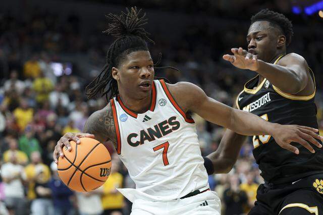 ST LOUIS, MISSOURI - MARCH 20: Shelton Henderson #7 of the Miami (FL) Hurricanes drives the ball against Mark Mitchell #25 of the Missouri Tigers during the second half in the first round of the 2026 NCAA Men's Basketball Tournament at Enterprise Center on March 20, 2026 in St Louis, Missouri. (Photo by Jamie Squire/Getty Images)